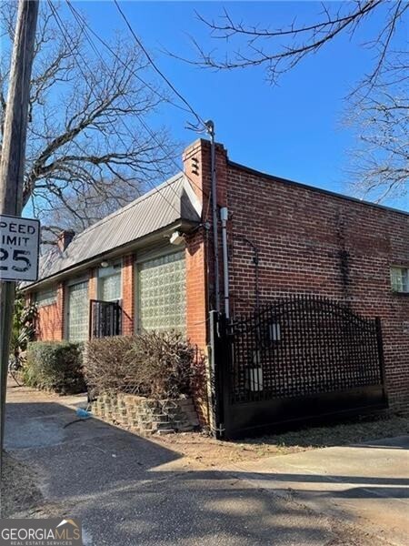 a view of a brick house with a street