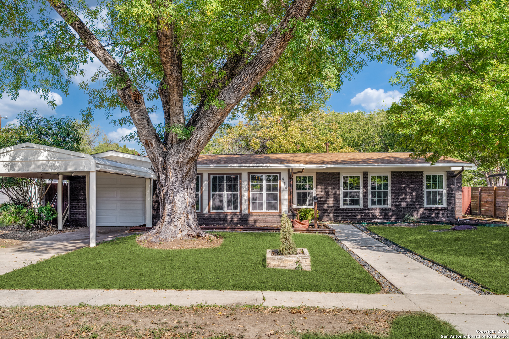 front view of a house with a yard