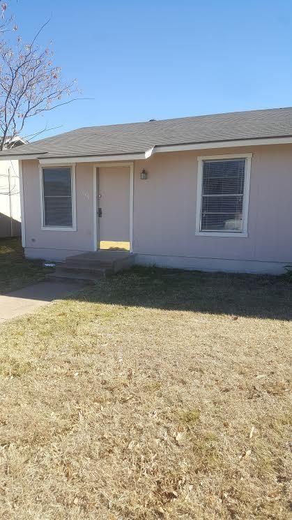 a view of a backyard of the house