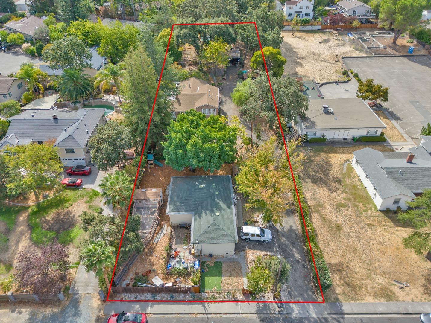 an aerial view of residential houses with outdoor space