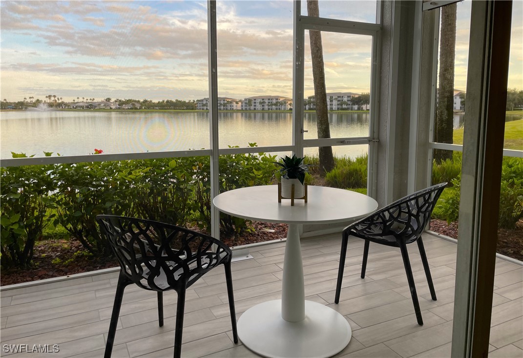 a table that has some chairs on it and wooden floor