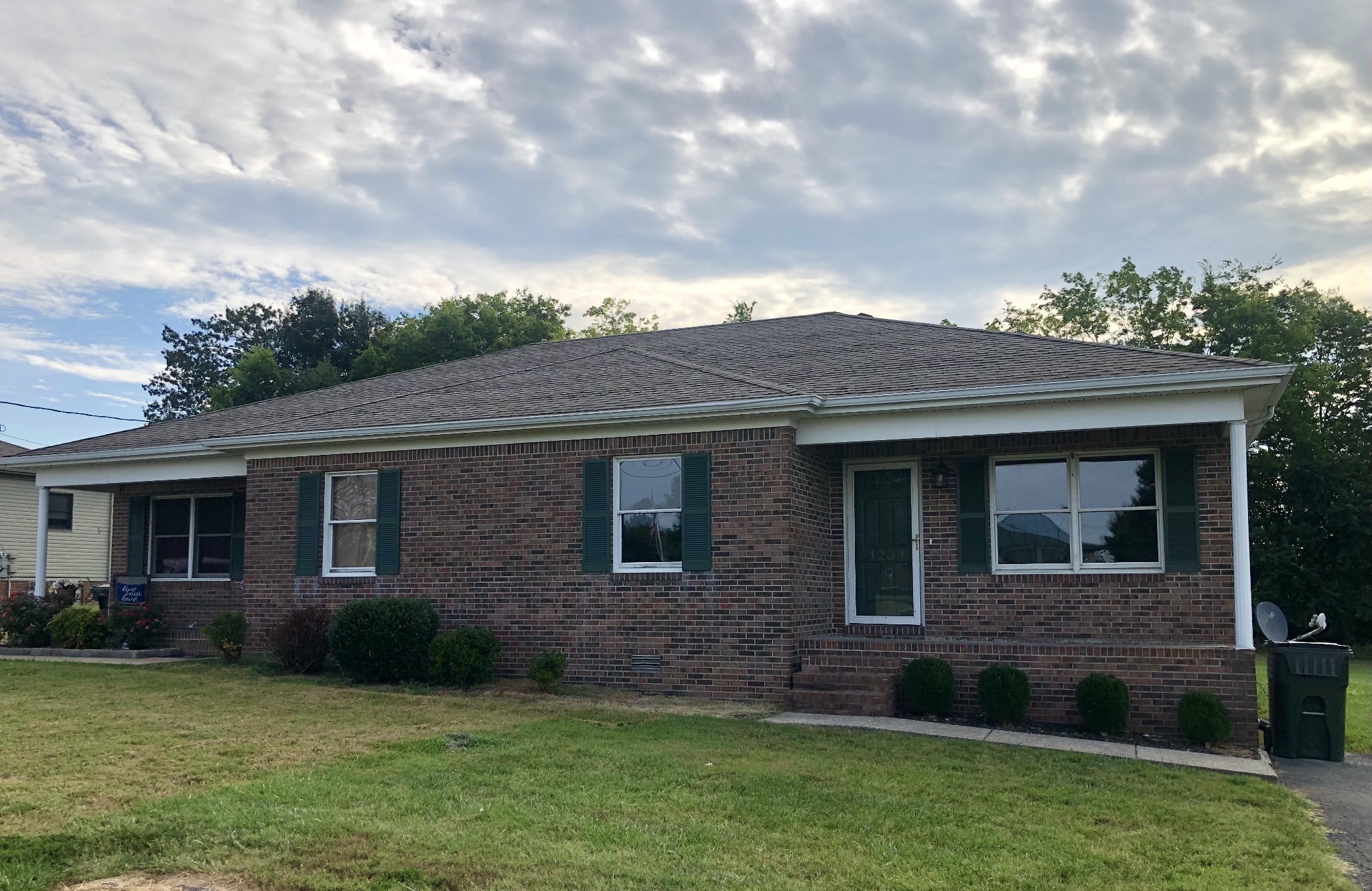 a brick house with a yard