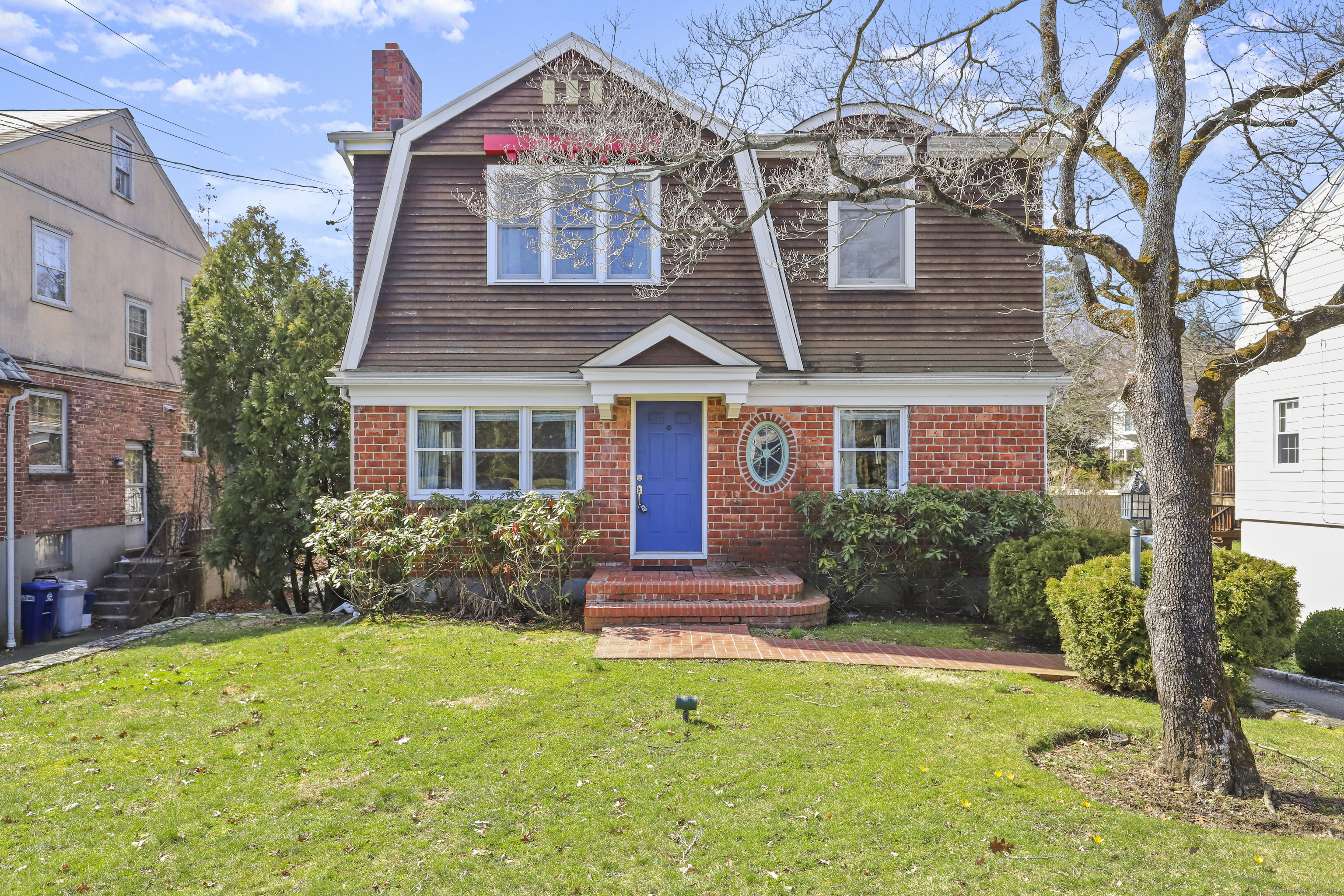 a front view of a house with garden