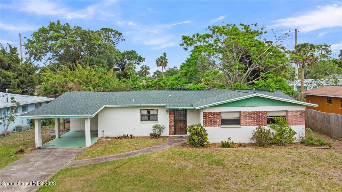 front view of a house with a yard