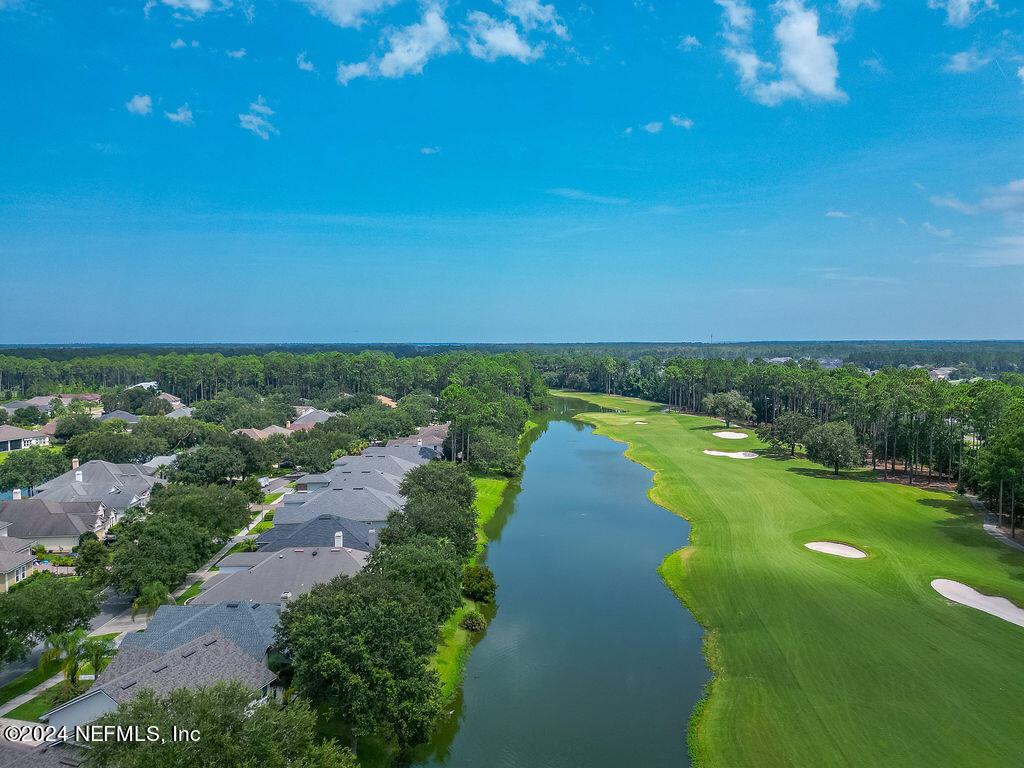 a view of a lake with a big yard