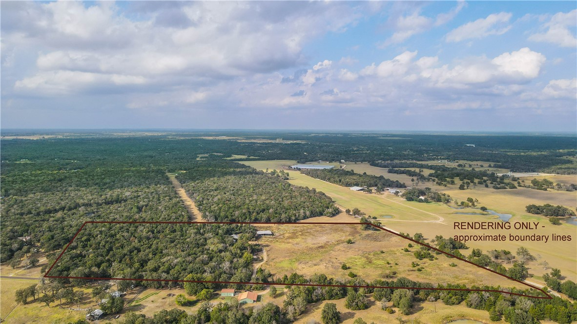 Birds eye view of property with a rural view