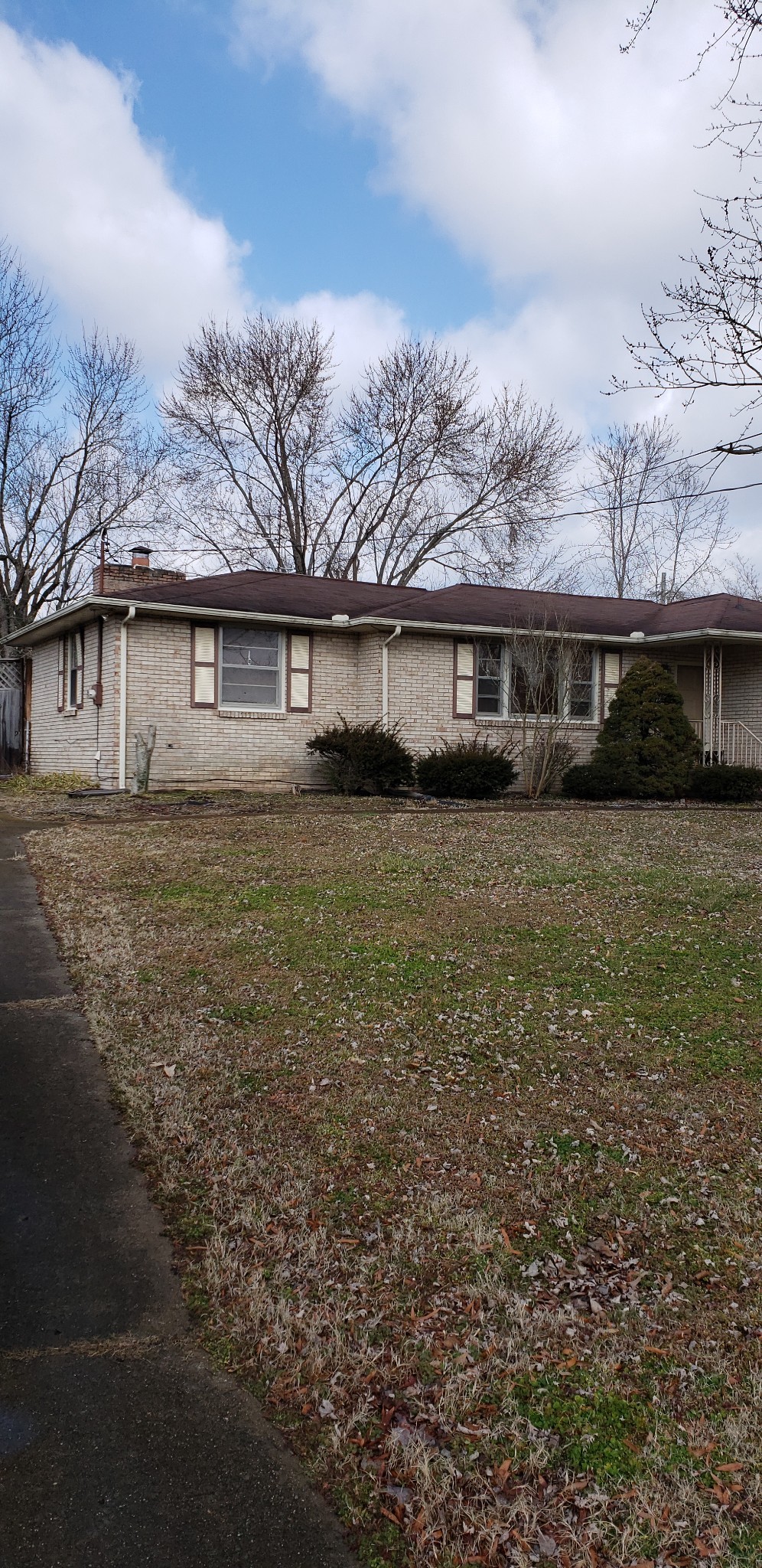 front view of a house with a yard