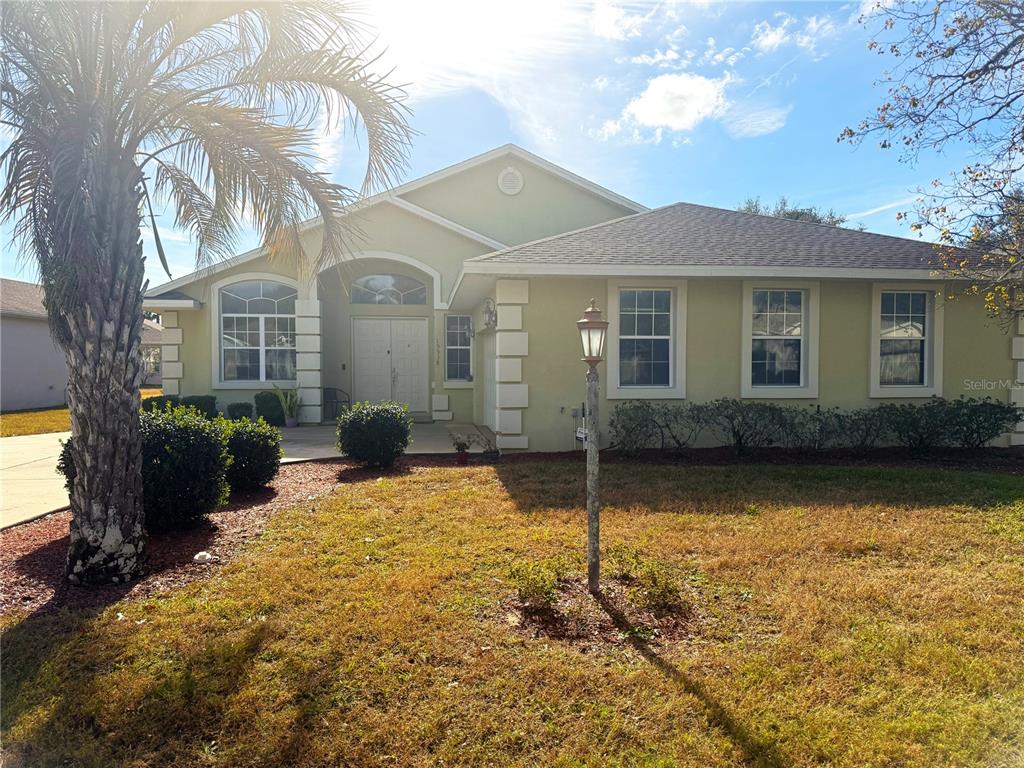 a front view of a house with yard