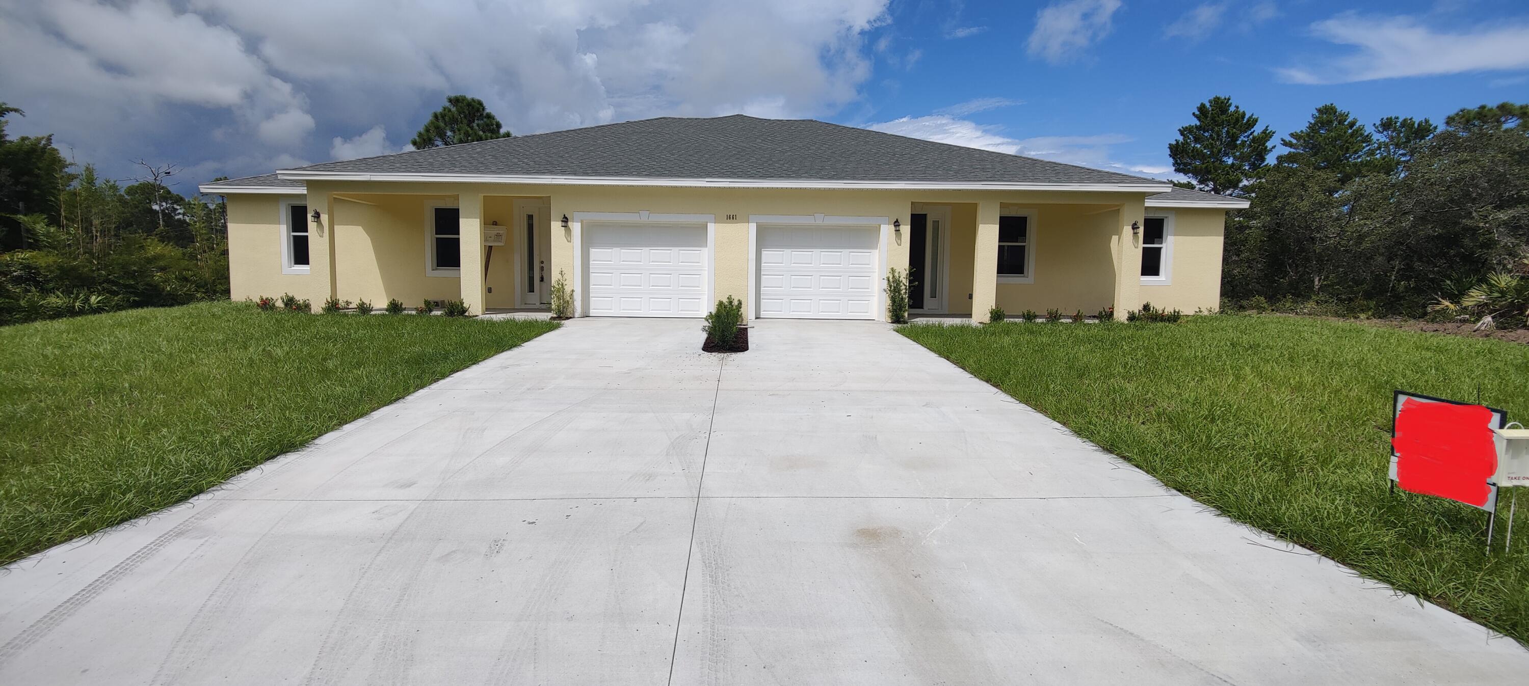 front view of a house with a yard