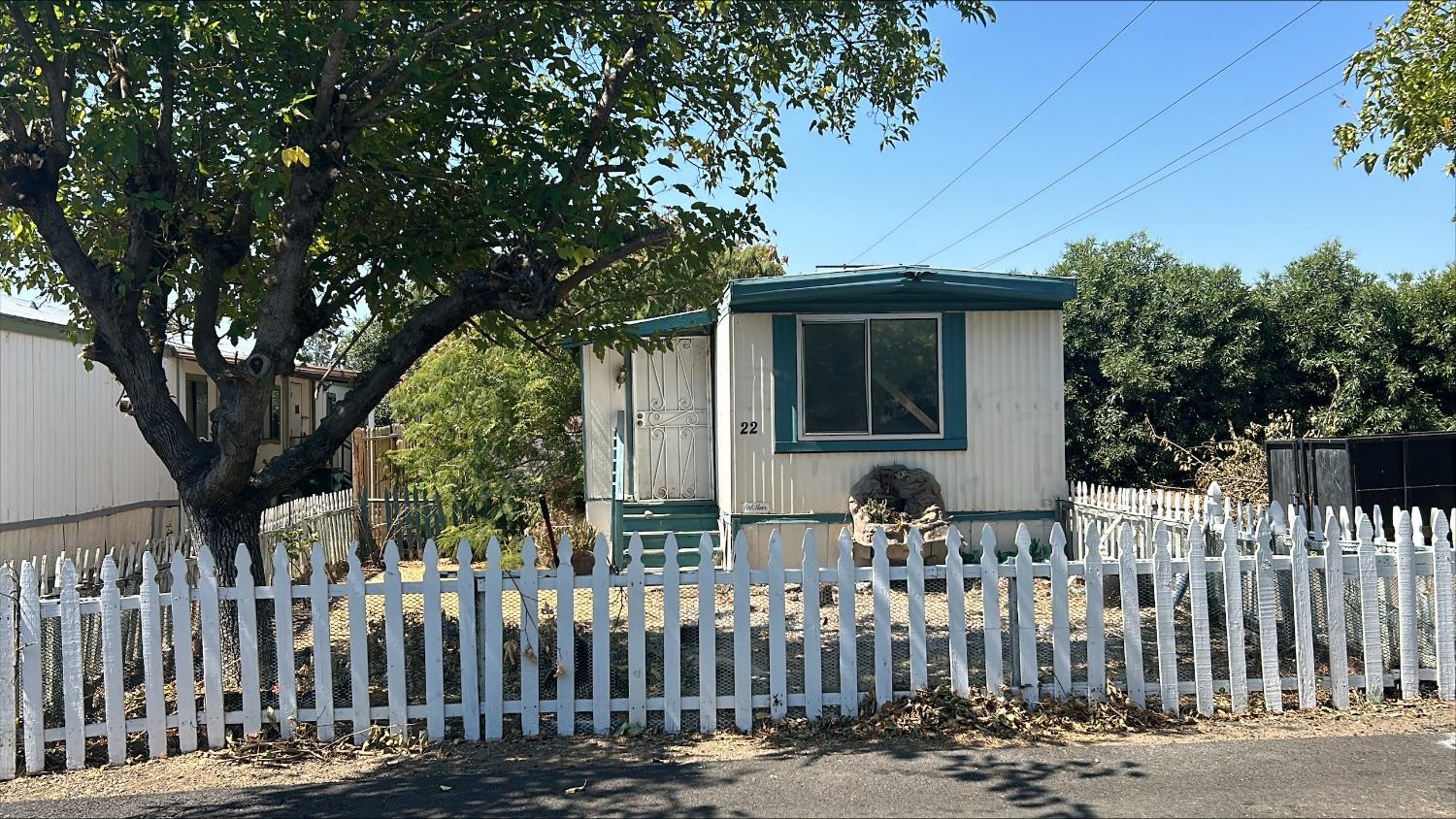 a front view of house with small garden