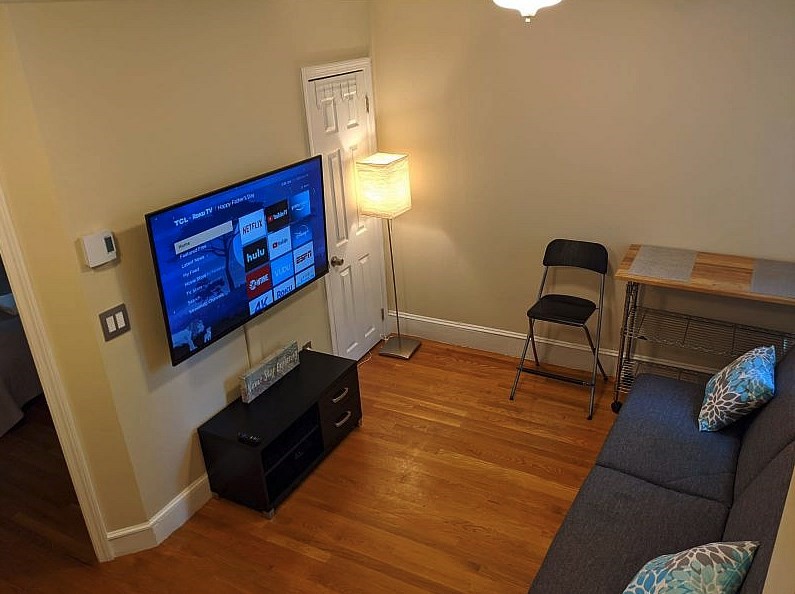 a room with furniture and wooden floor