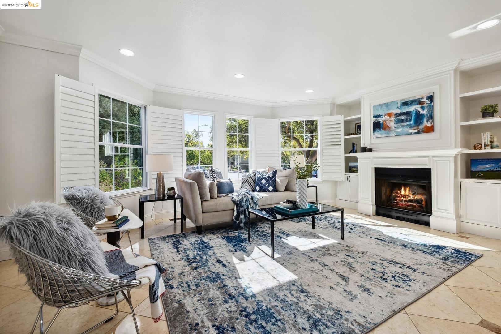 a living room with furniture windows and a fireplace