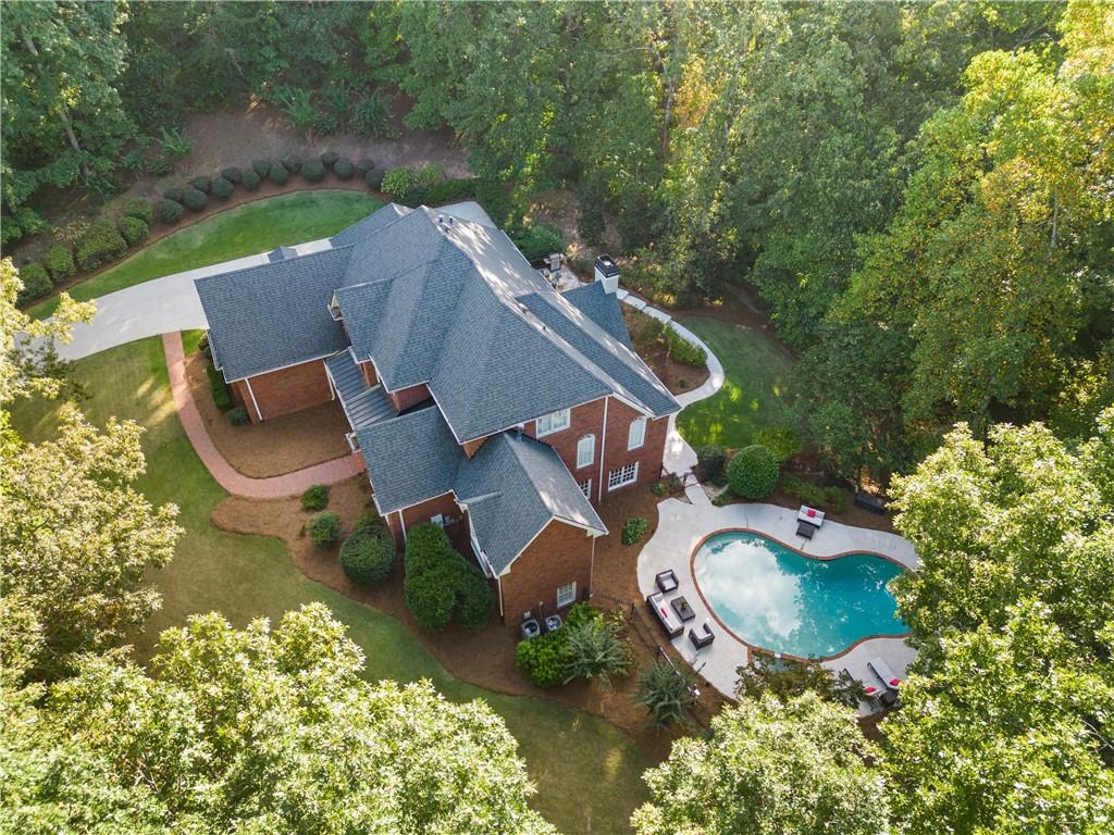 an aerial view of a house with outdoor space