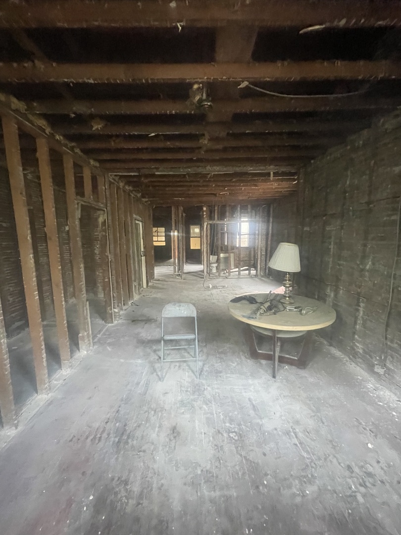 a view of a dinning table and chairs in a room