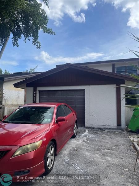 a car parked in front of garage