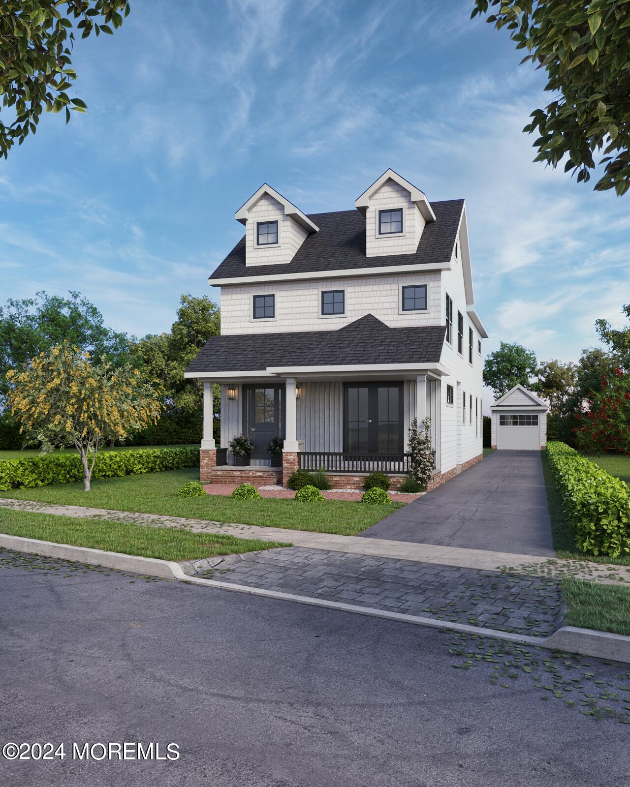 a front view of a house with a yard and trees