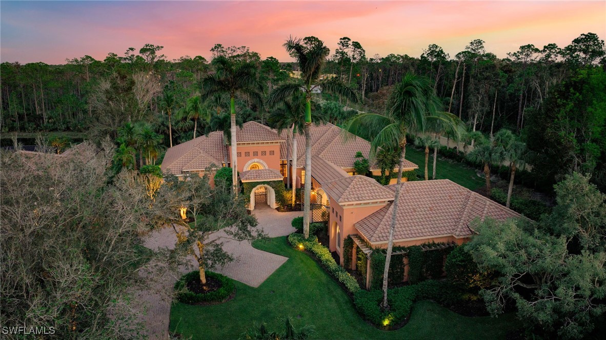 a aerial view of a house with table and chairs in patio