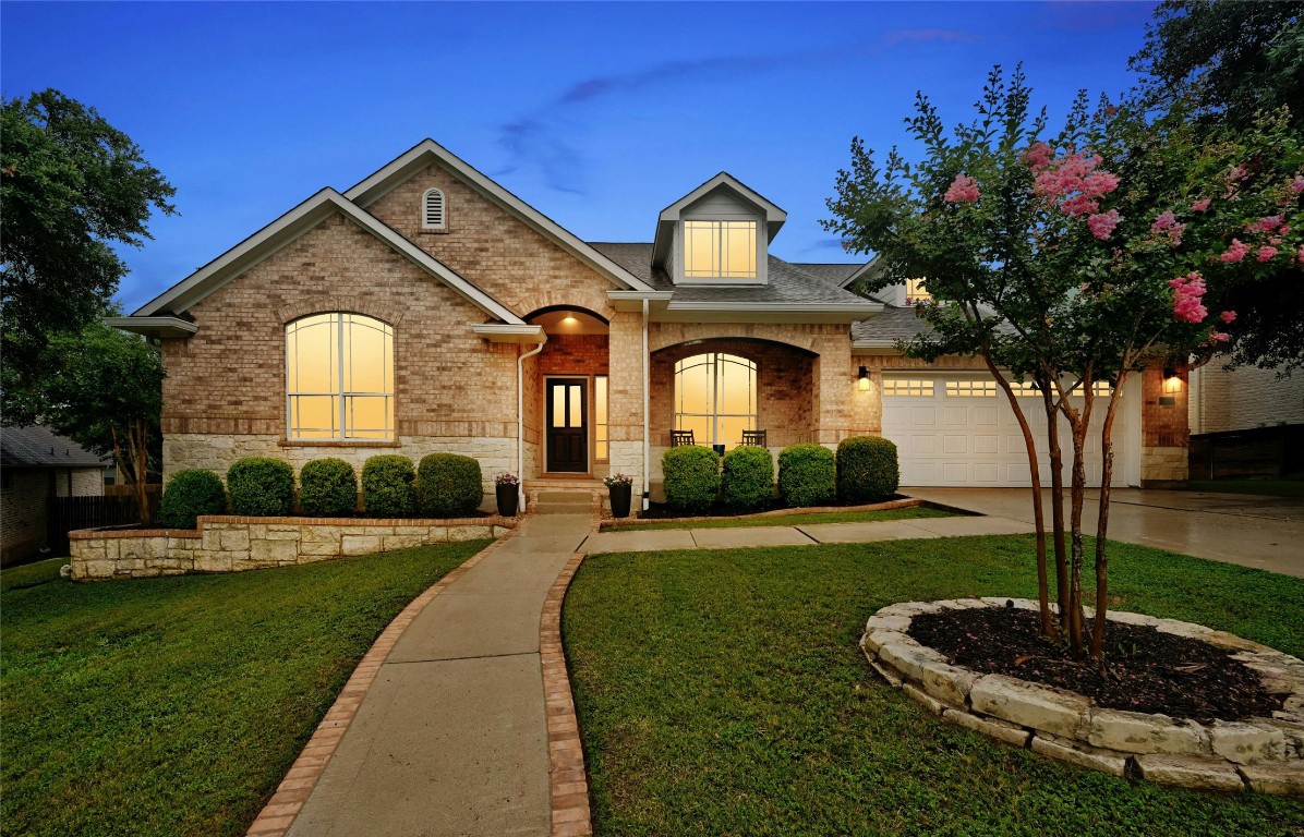 a front view of a house with a yard