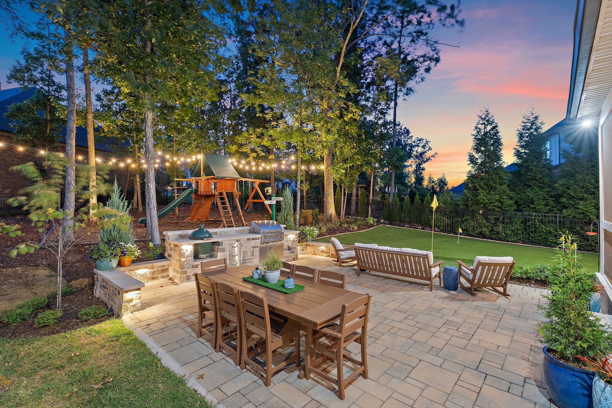 a view of backyard with seating area and green space