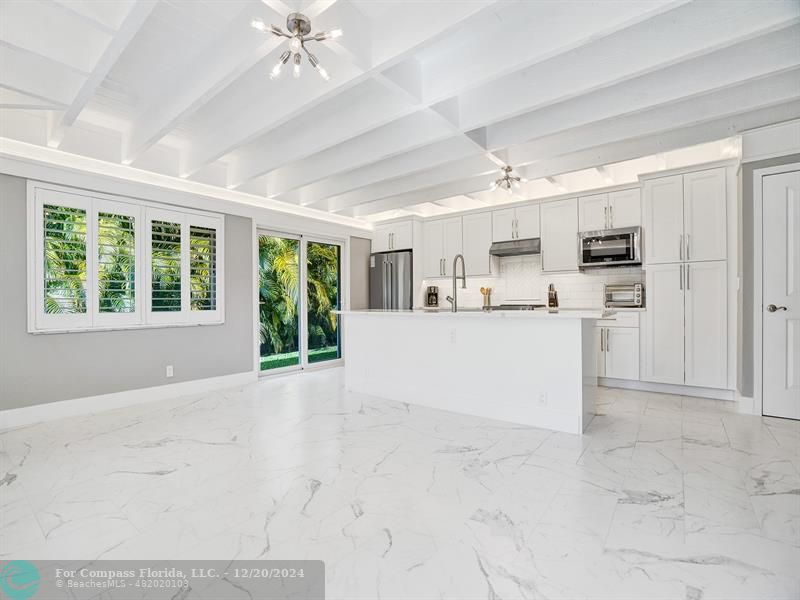 Open Kitchen with Large Island & SS Appliances