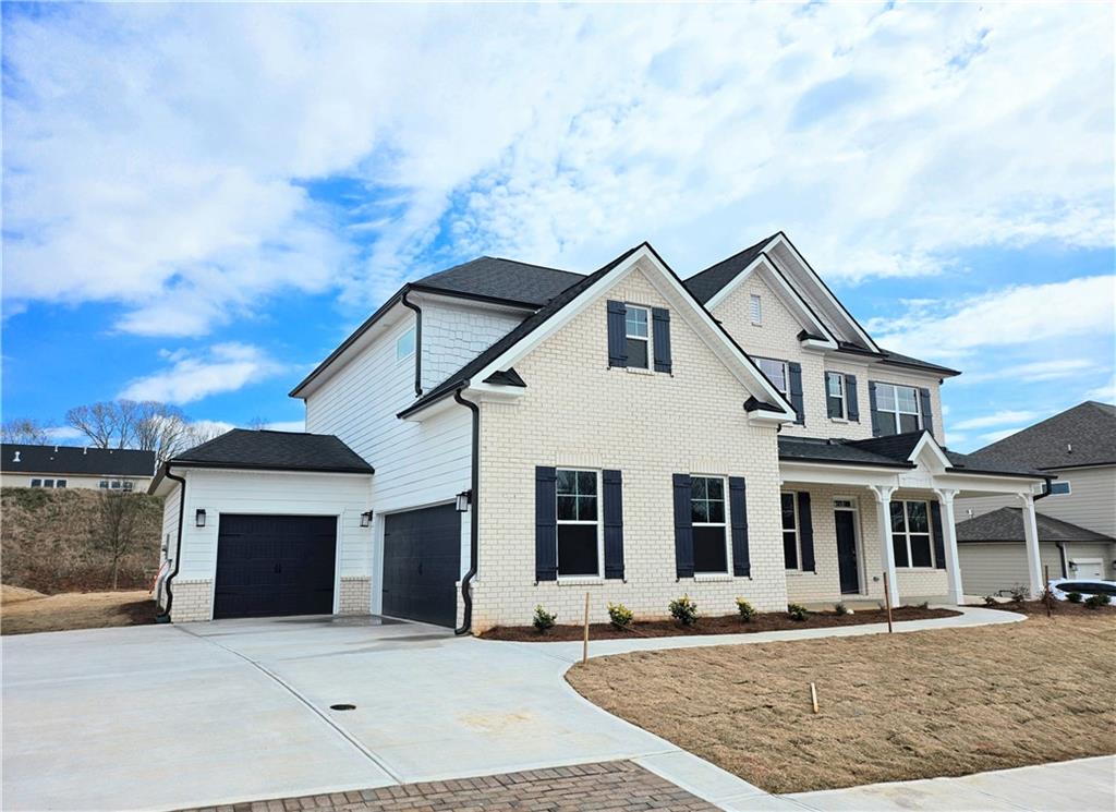 a front view of a house with yard