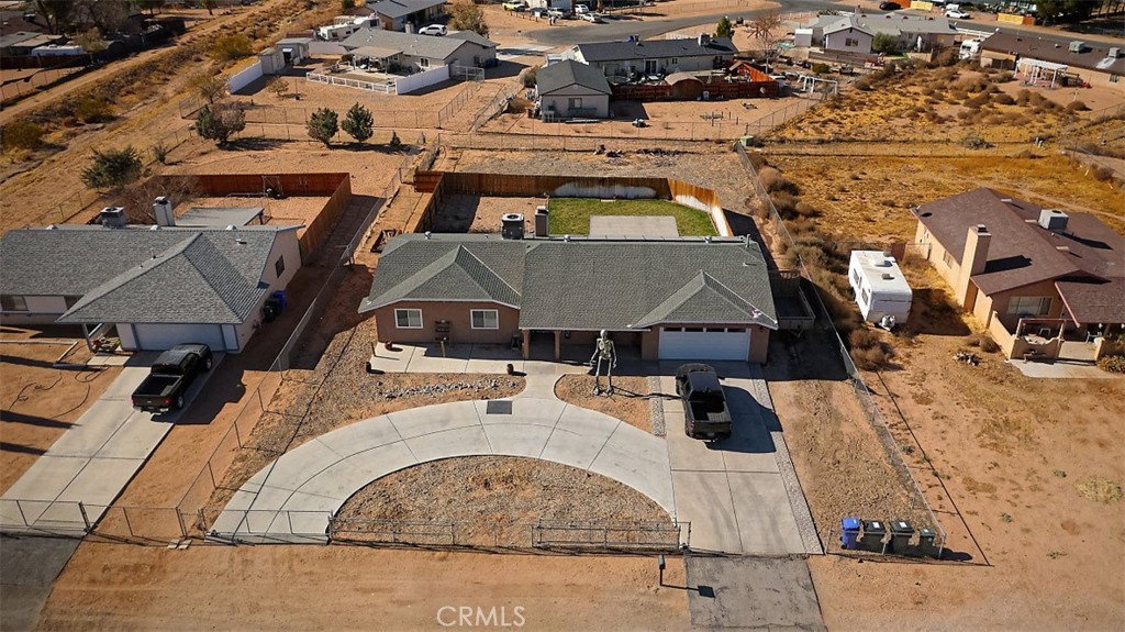 an aerial view of a house with a swimming pool