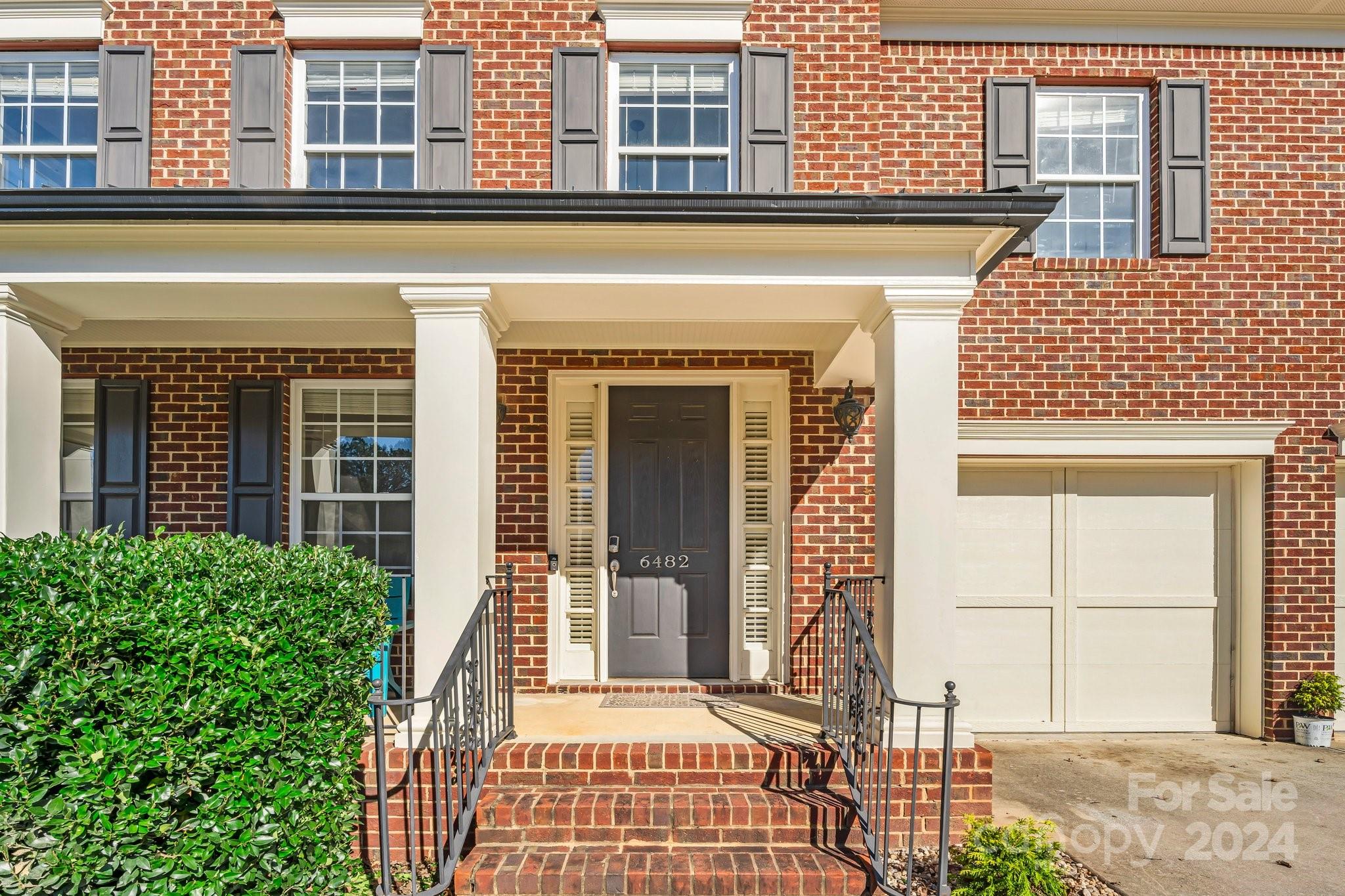 front view of a brick house with a window