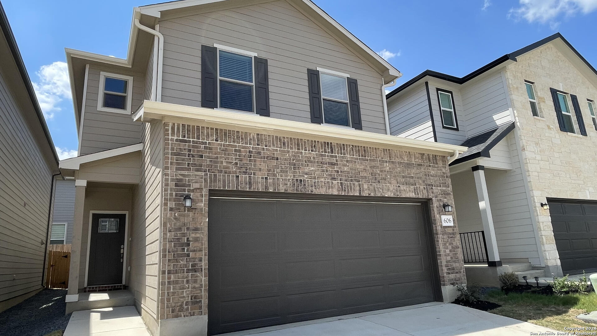 a front view of a house with garage