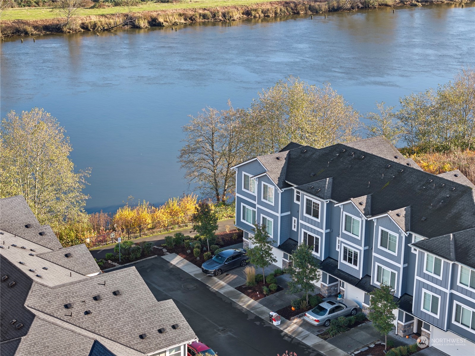 an aerial view of a house with a lake view