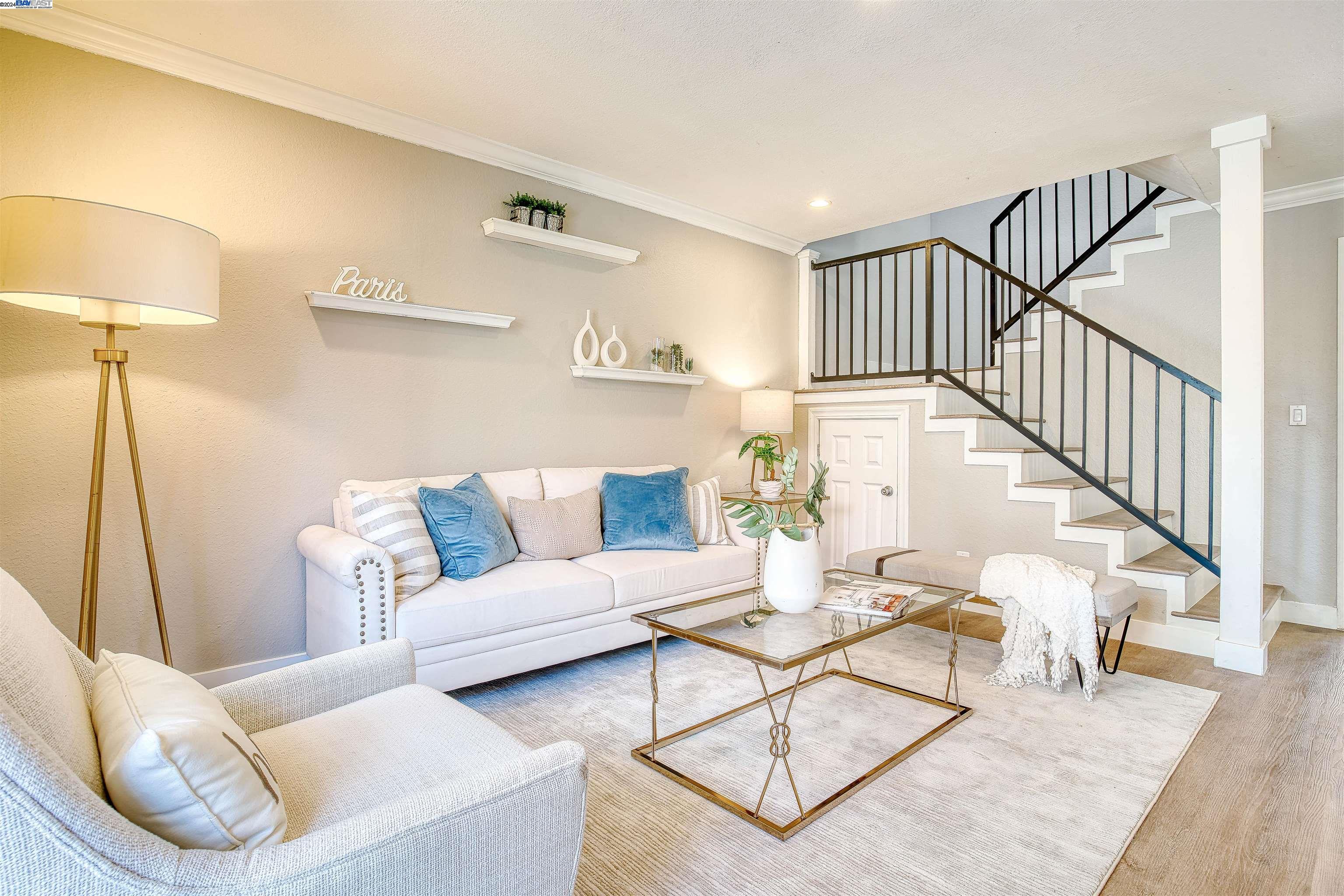 a living room with furniture and a table