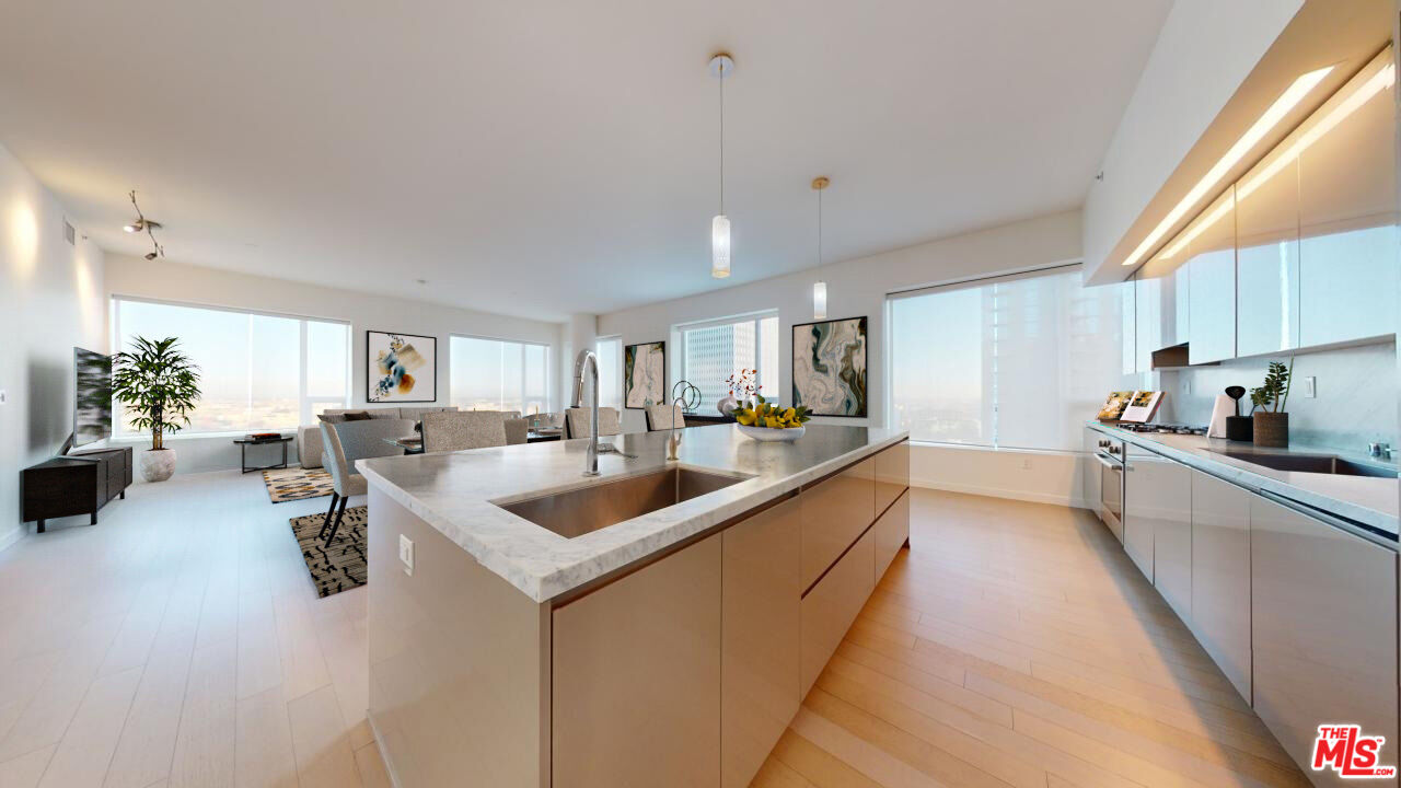 a large white kitchen with a large window