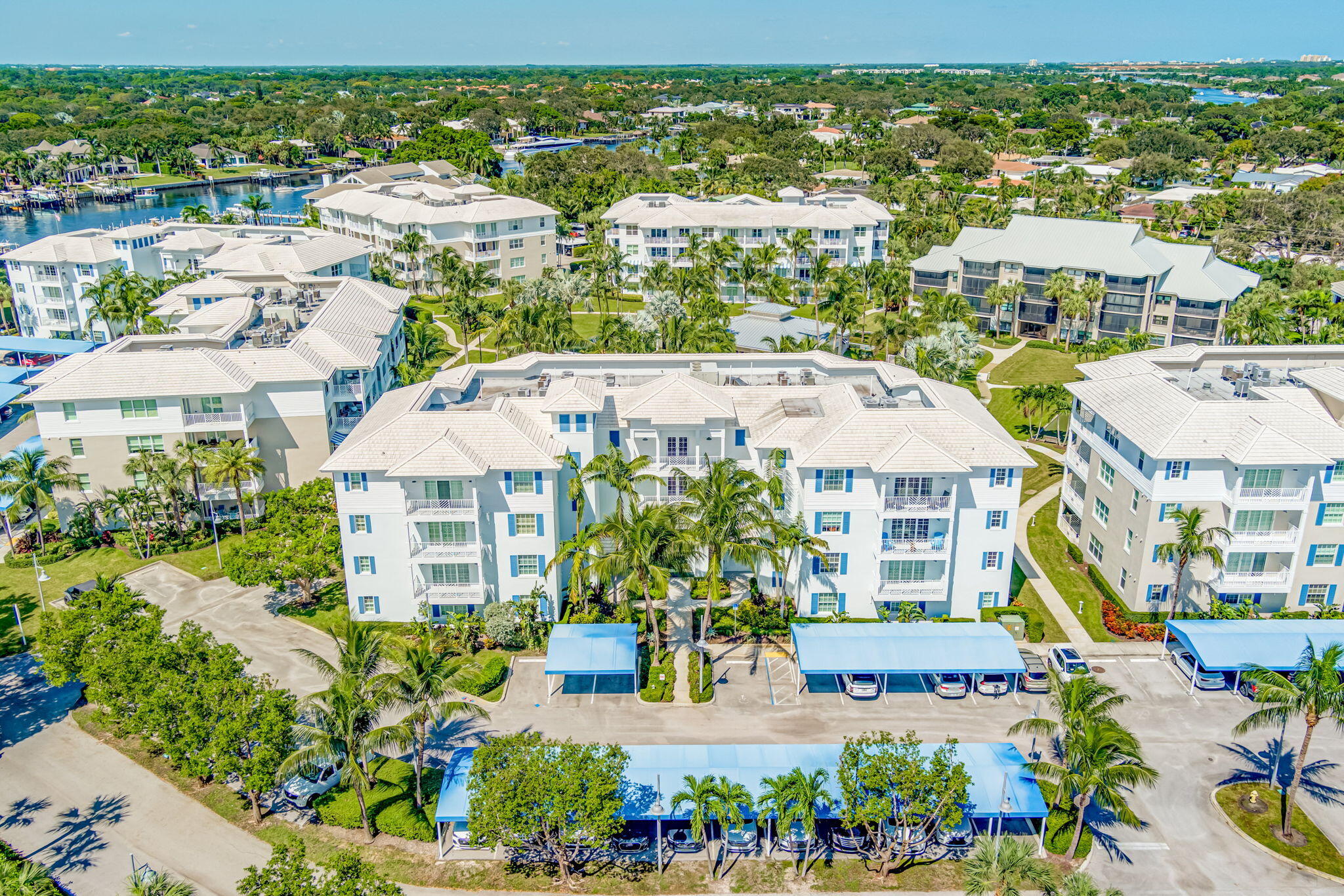 an aerial view of residential houses with outdoor space and street view