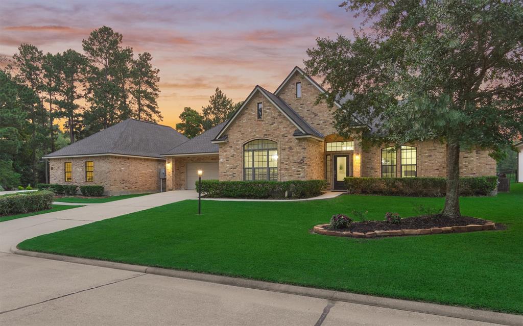 This is the main house and driveway with a 2-car garage. It offers 3 bedrooms and 2 bathrooms.