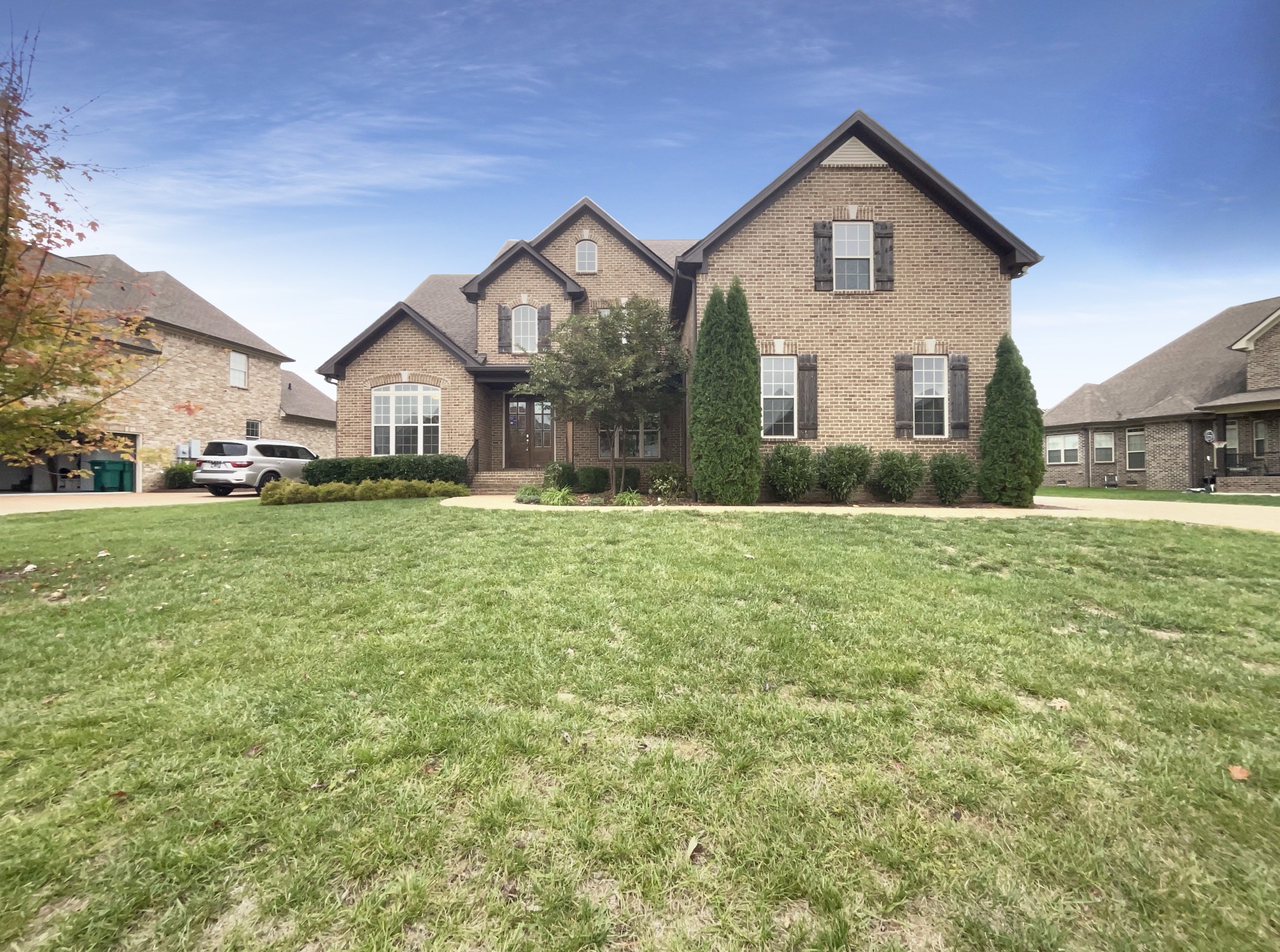 a front view of a house with a yard