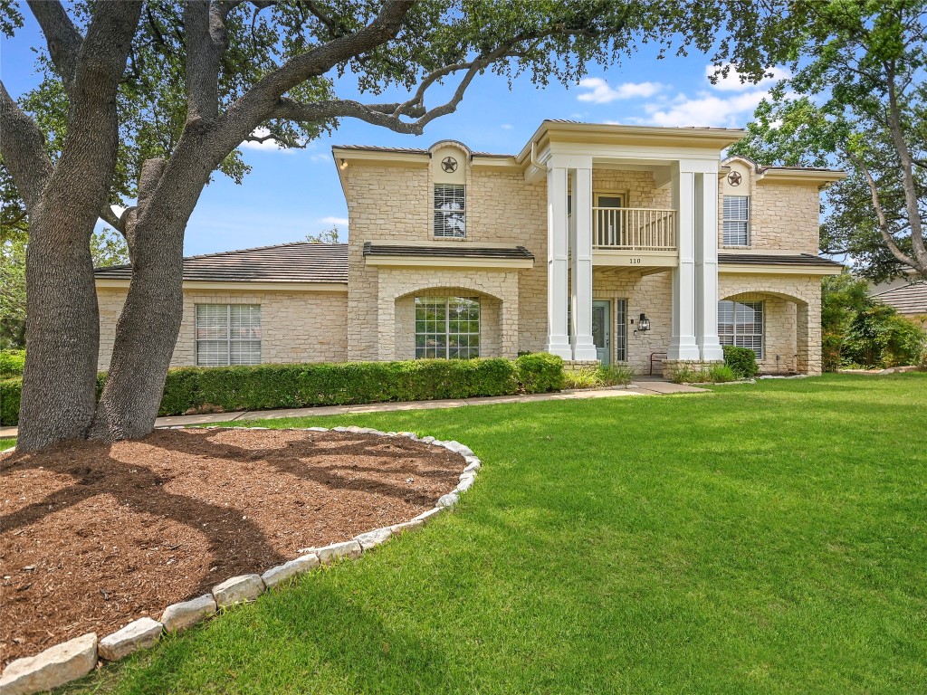 a front view of a house with a yard