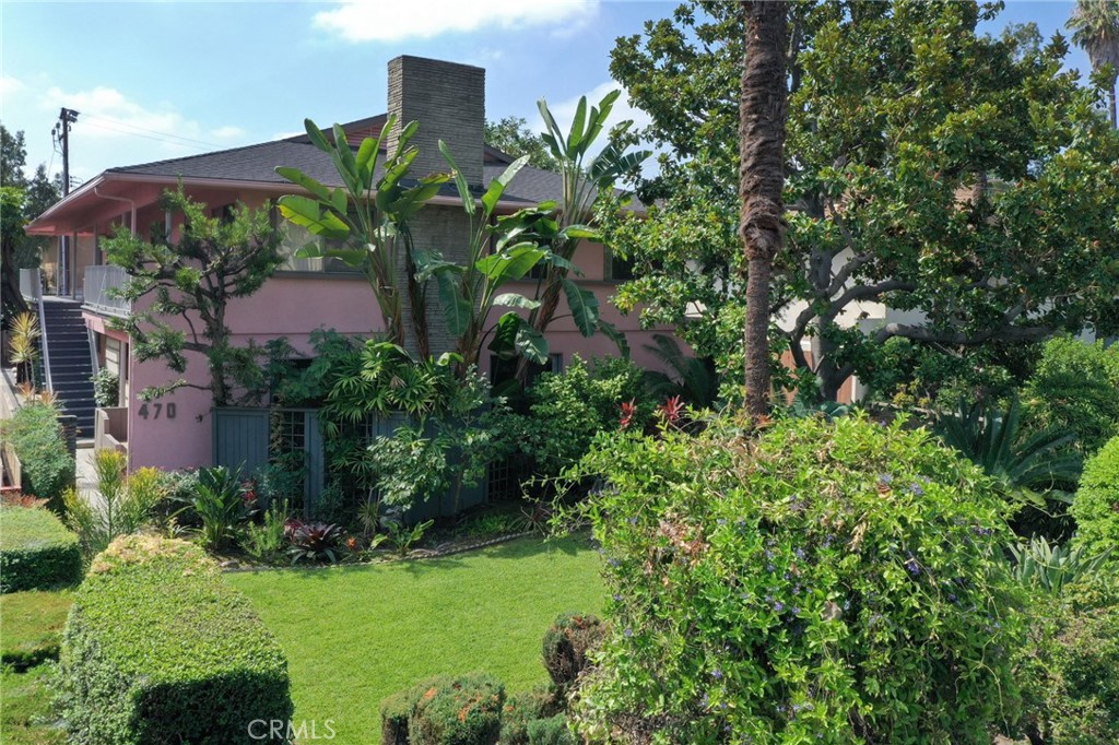 a view of a garden with a building