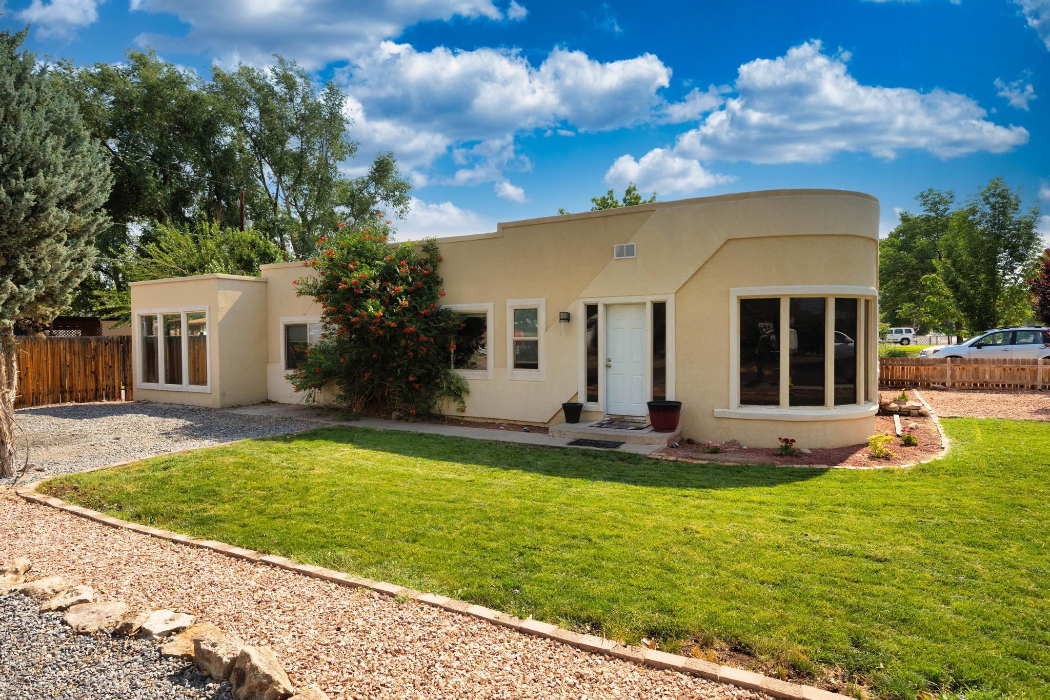 a front view of house with yard and seating area