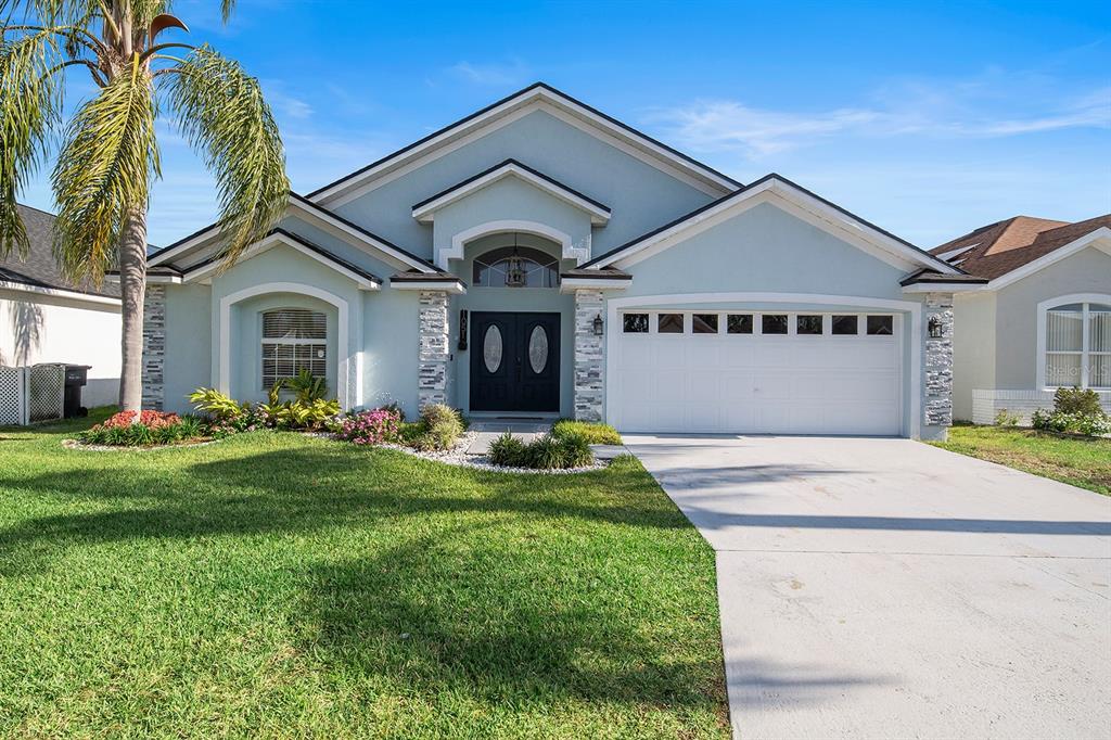 a front view of a house with a yard