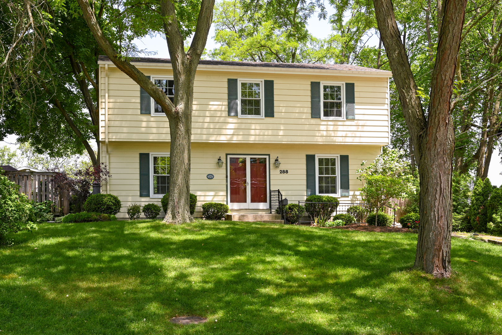 front view of a house with a yard