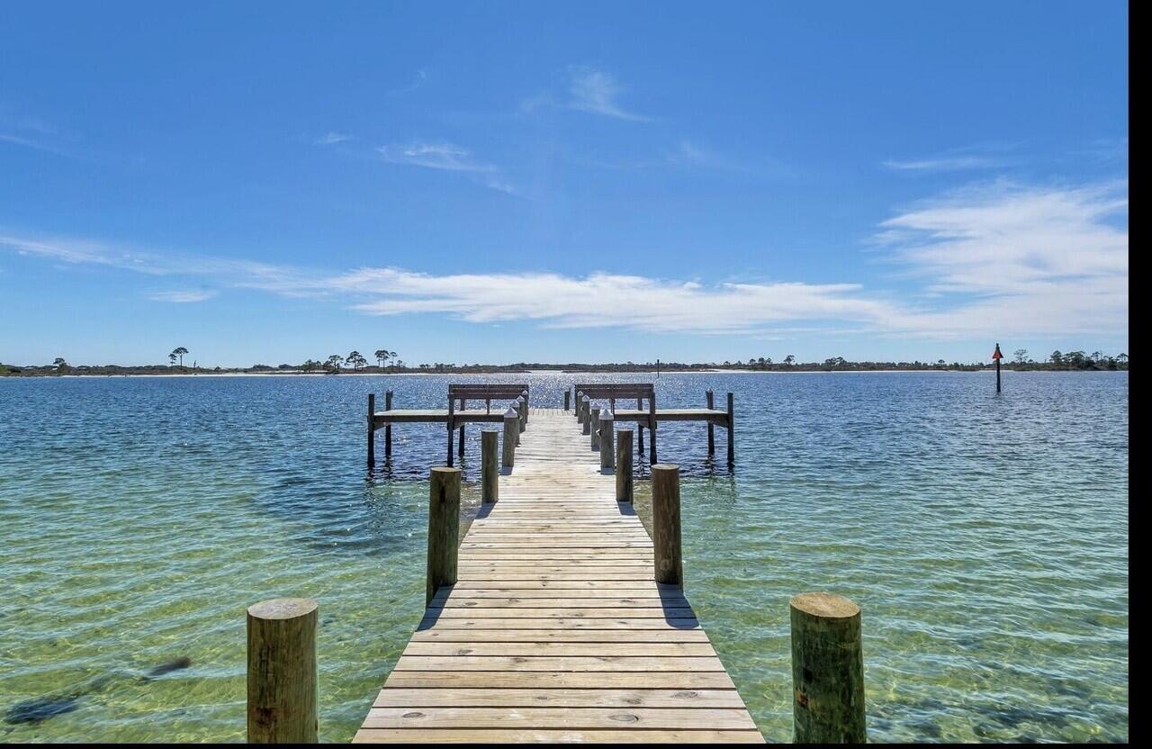 a view of a lake with outdoor seating