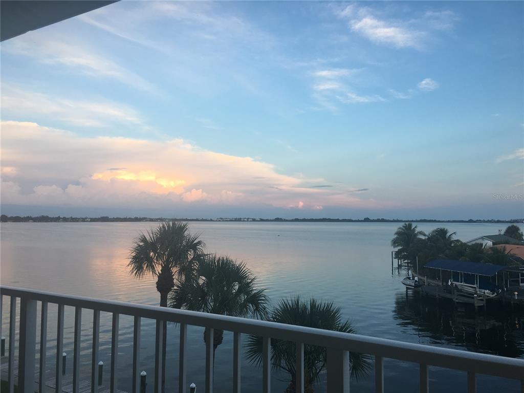 a view of a lake from a balcony