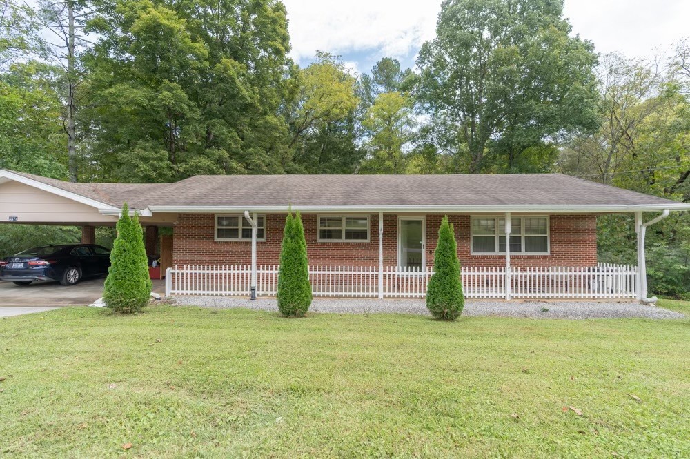 front view of a house with a yard