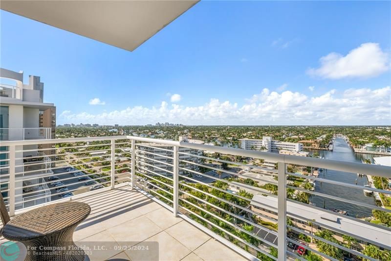 a view of a balcony with an ocean view