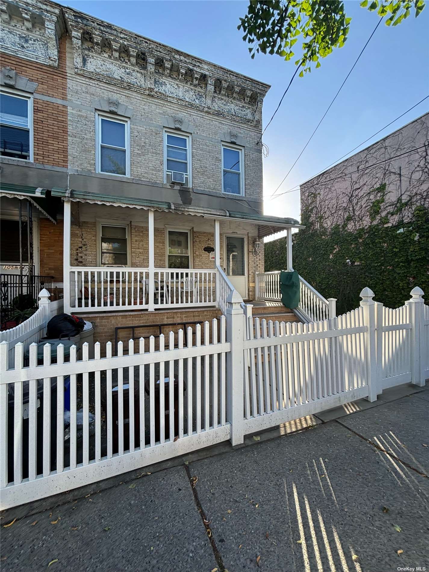 a view of a house with wooden fence