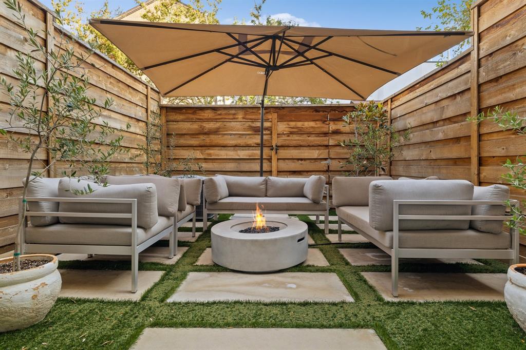 a outdoor space with patio the couches and a chair with the garden view