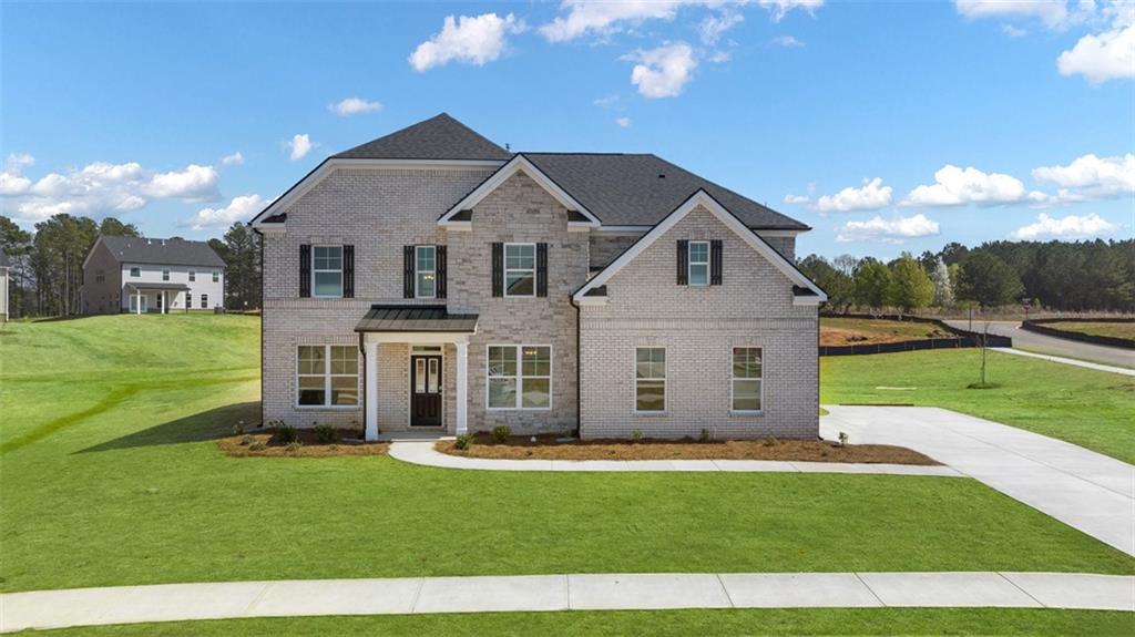 a front view of a house with a yard