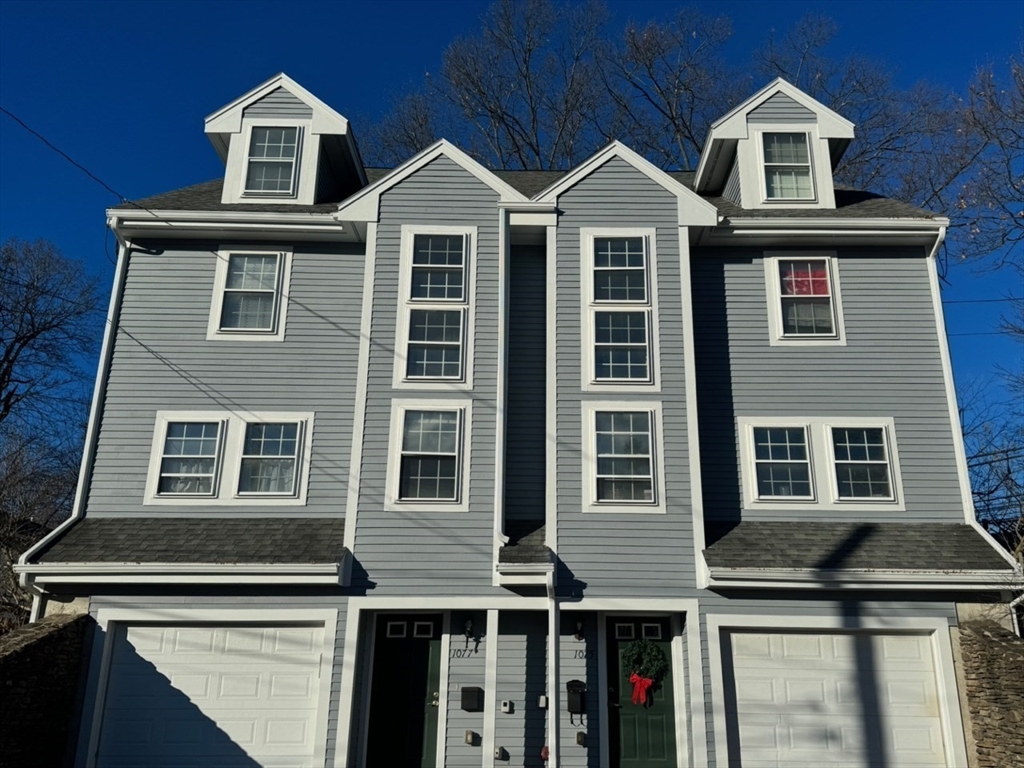 a front view of a large residential apartment building