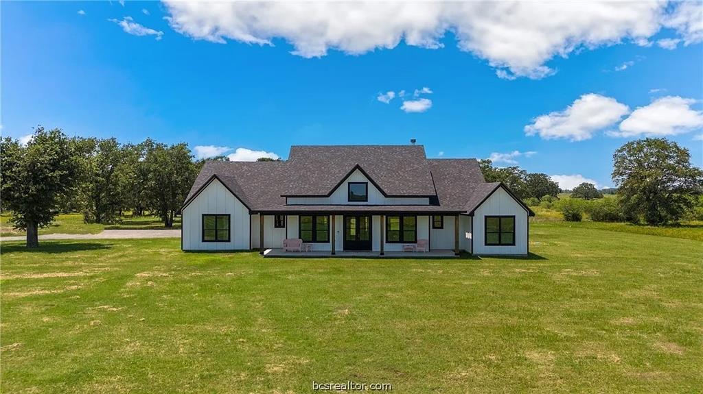 a view of a house with a big yard