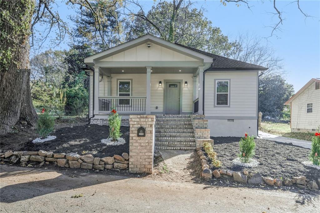 a front view of a house with garden