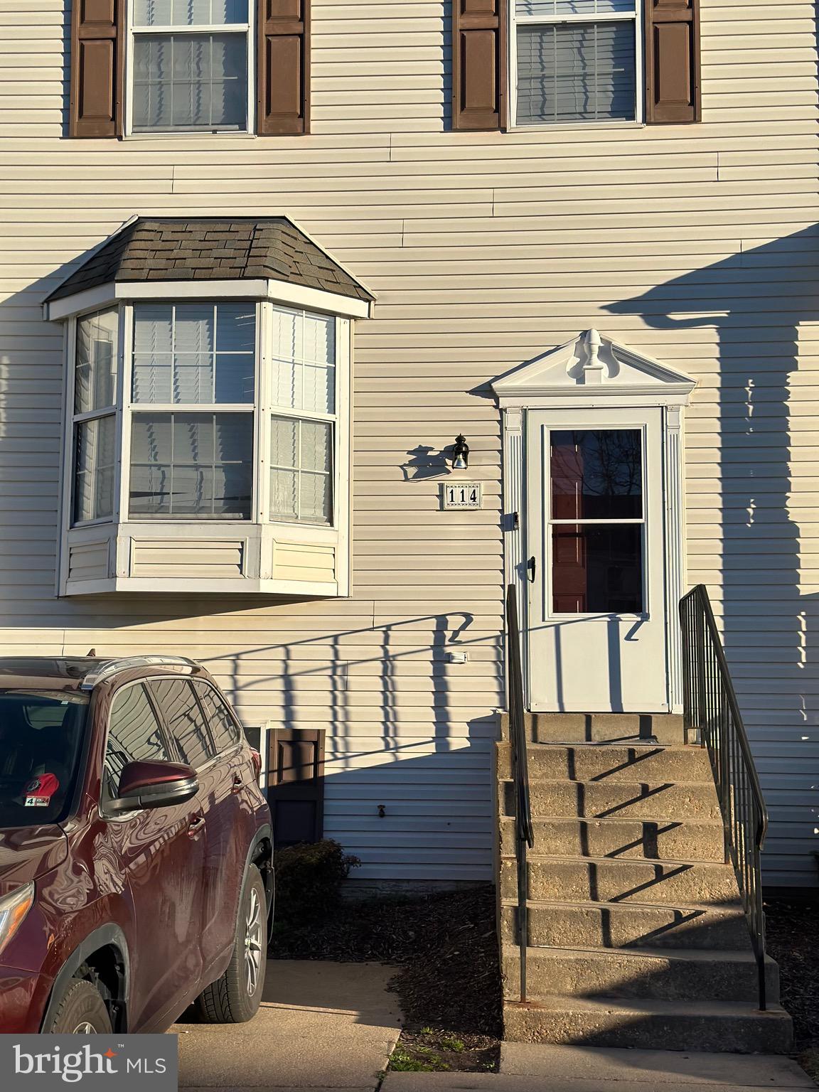 a view of a house with a door and a window